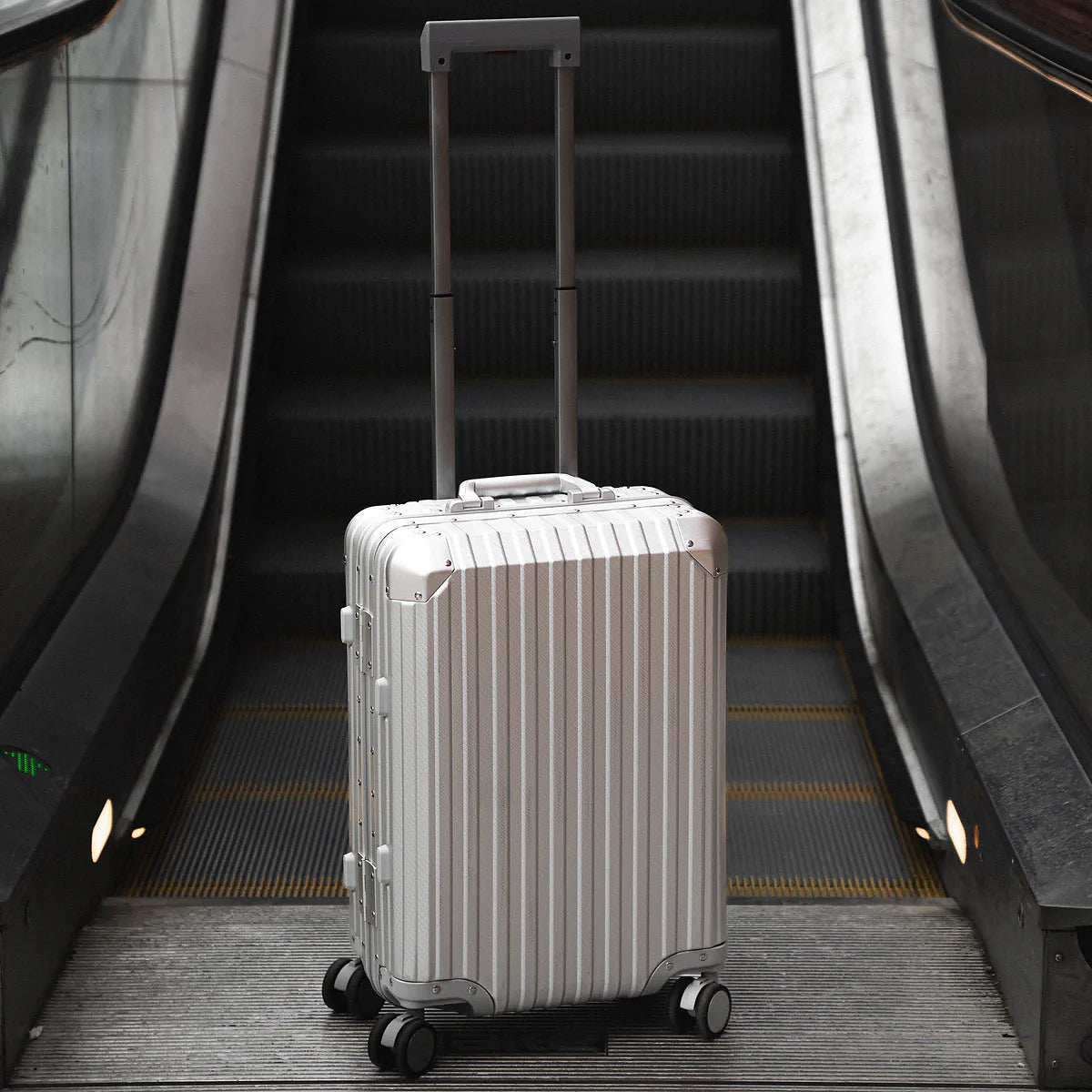 Argent Classic silver aluminium suitcase side view showing premium hard shell design and luxury travel finish