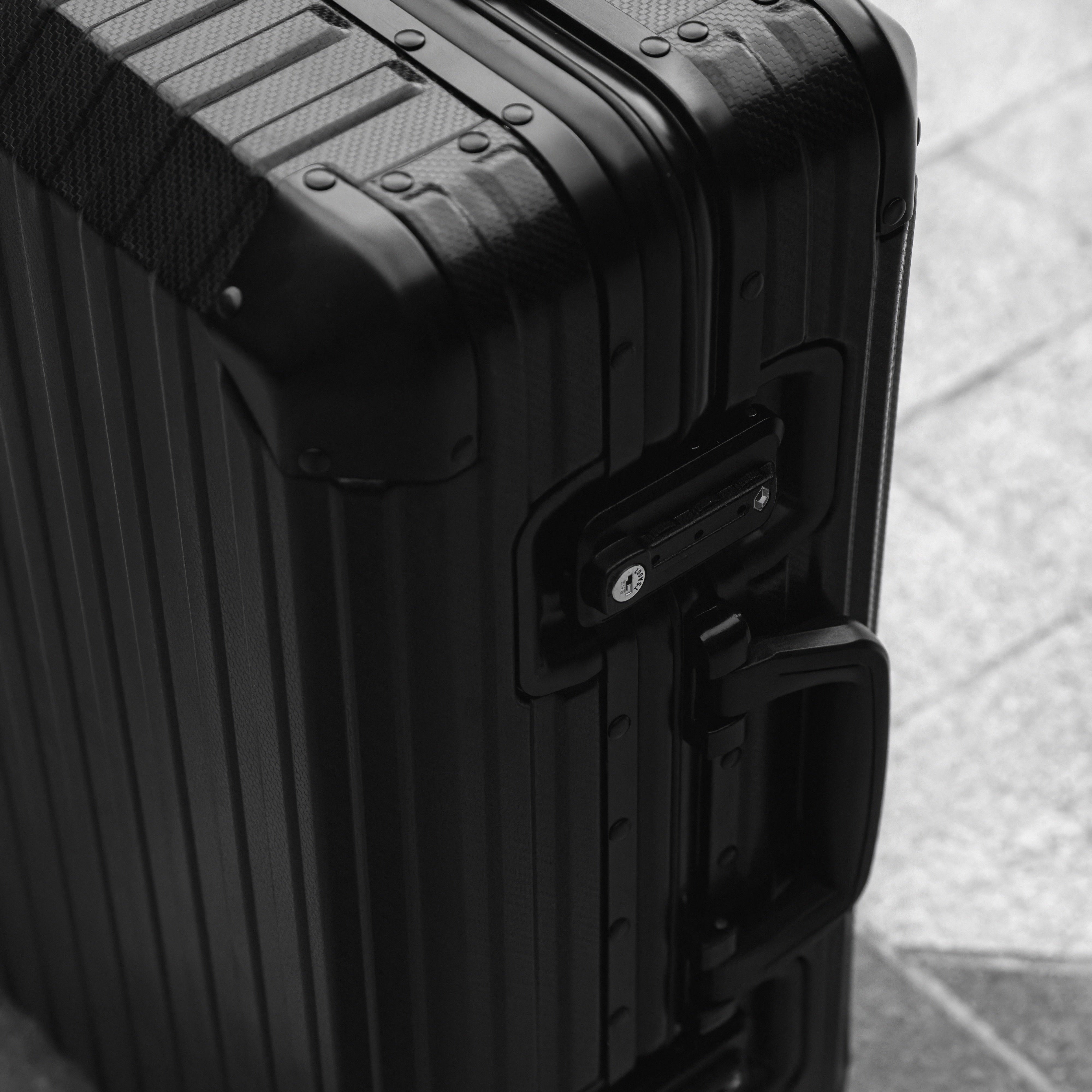Noir Atelier Black aluminium suitcase view showing premium hard shell design and luxury travel finish