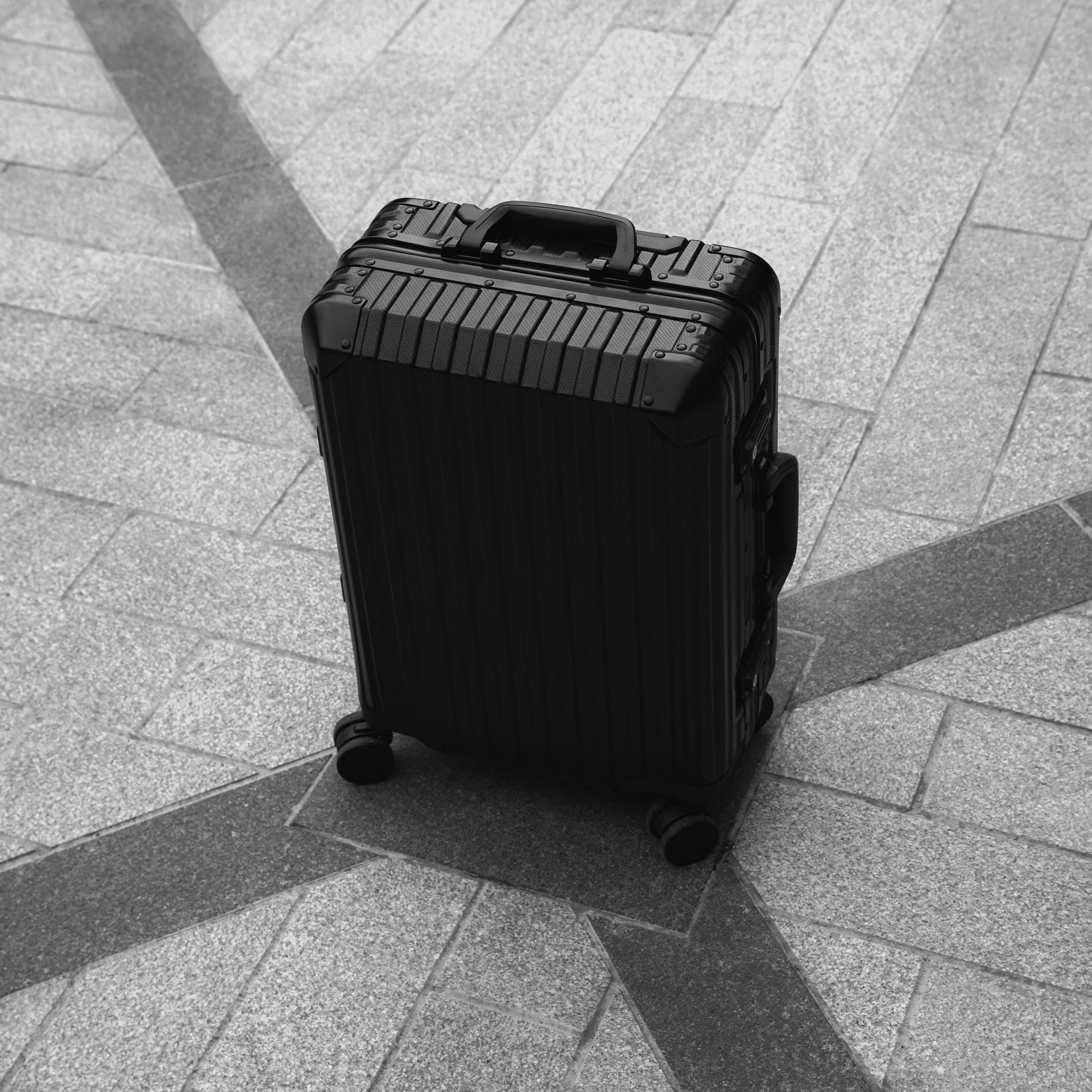 Noir Atelier Black aluminium suitcase view showing premium hard shell design and luxury travel finish