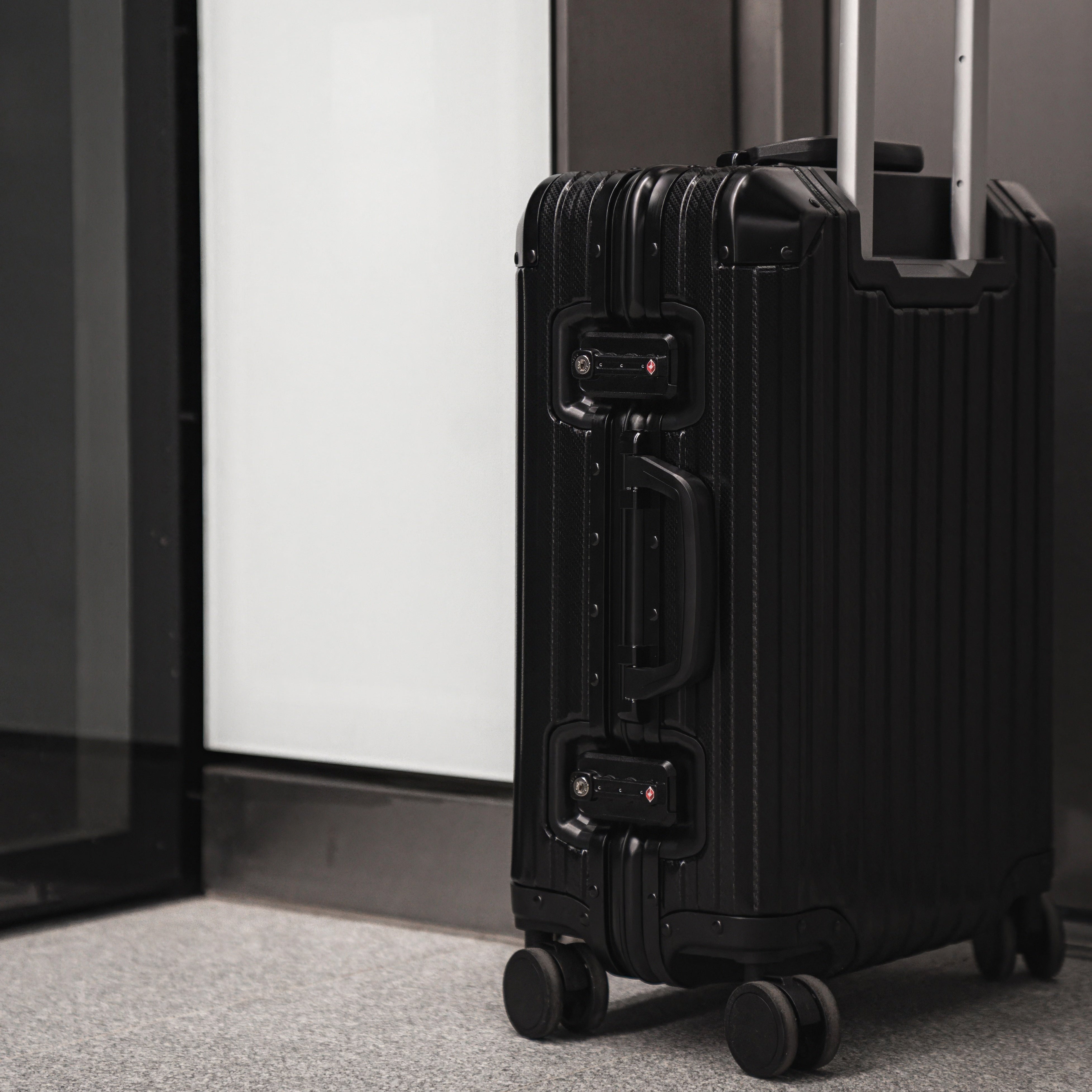 Noir Atelier Black aluminium suitcase view showing premium hard shell design and luxury travel finish